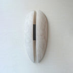 Unlit Clérachic alabaster sconce photographed straight on, showing the narrow slot that runs the full height between the two stone halves.
