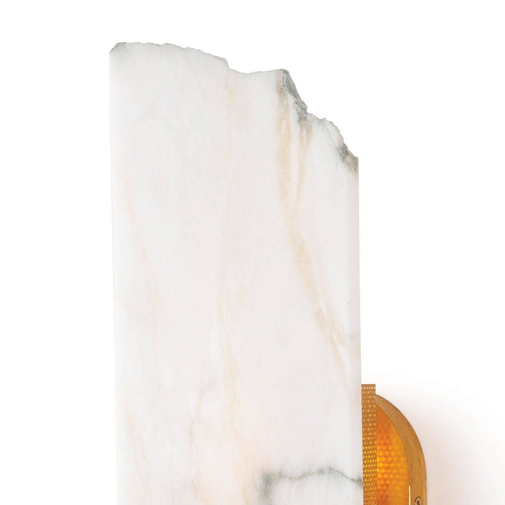 Macro of the Clérachic Alabaster Wall Sconce shade, the raw broken top edge and honey veins running through the stone.