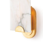 Detail of the Clérachic Alabaster Wall Sconce base, where a gold half-moon cradle holds the stone against the oval plate.