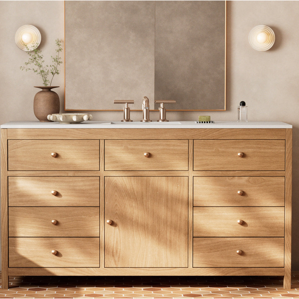 A pair of Clérachic alabaster sconces mounted either side of a mirror above an oak cabinet, throwing an even light across the wall.