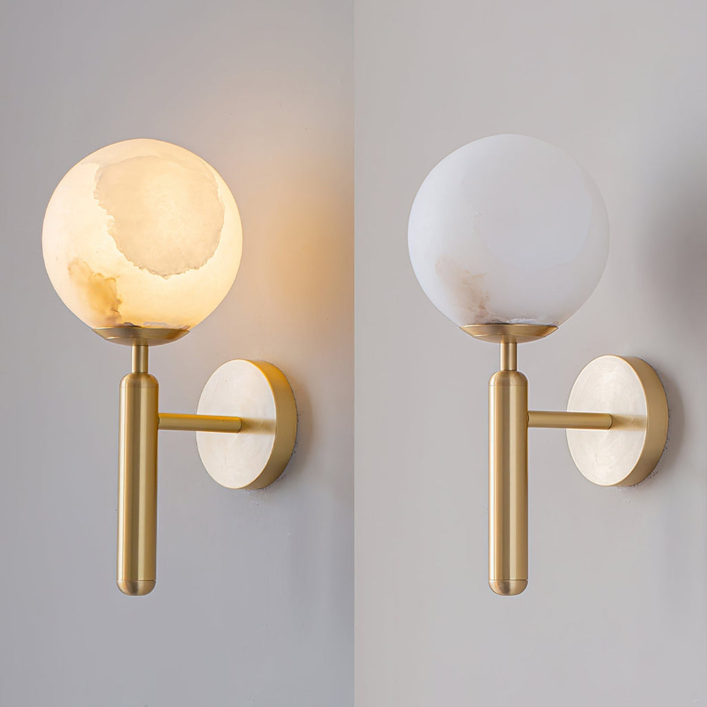 Side-by-side of the Clérachic alabaster wall sconce with the globe shade, lit and warm on the left, unlit and white on the right.
