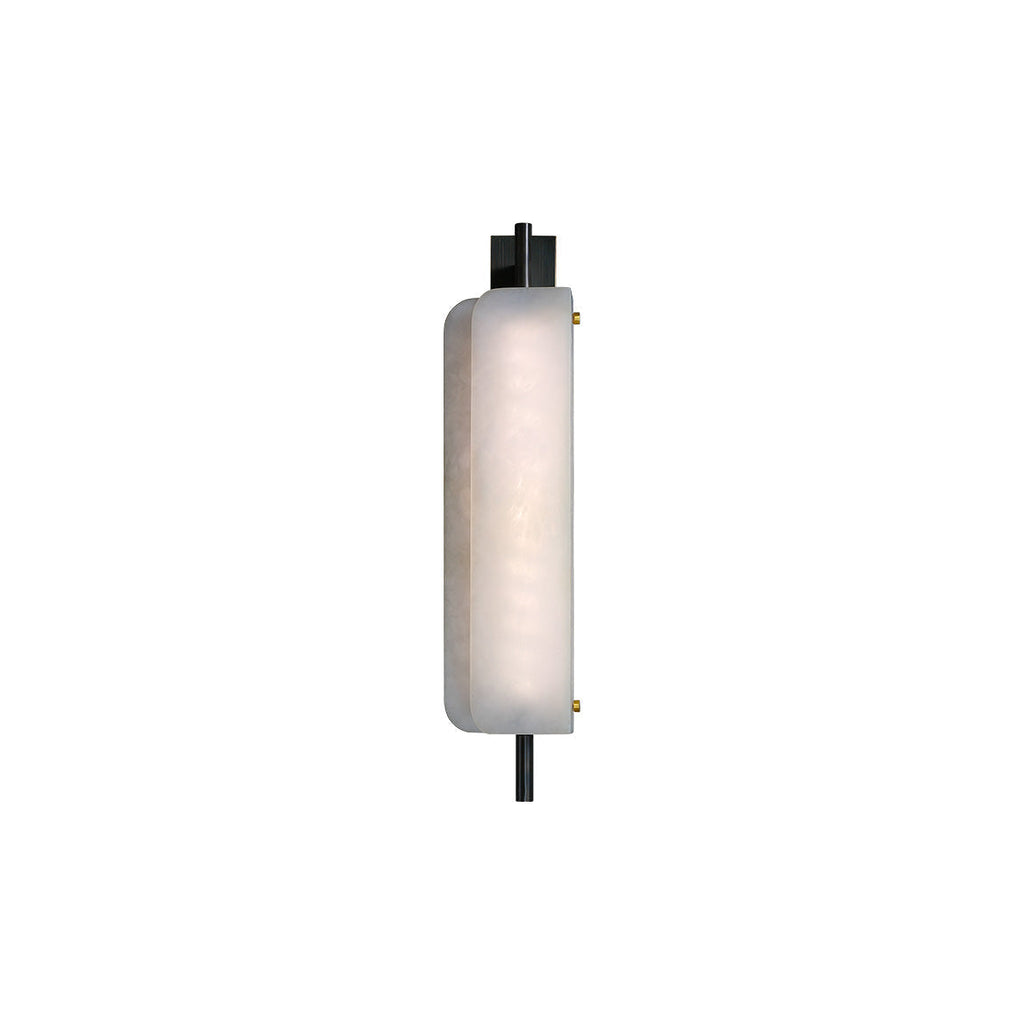 Clérachic Alabaster Wall Sconce lit against white, the front plate glowing from within while small brass pins hold it to the frame.