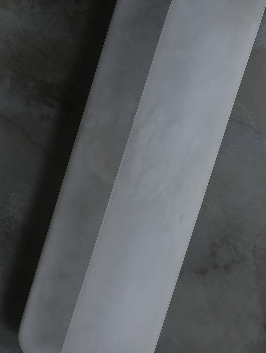 Close view of the Clérachic Alabaster Wall Sconce where one plate steps in front of the other, the seam running the full height of the stone.
