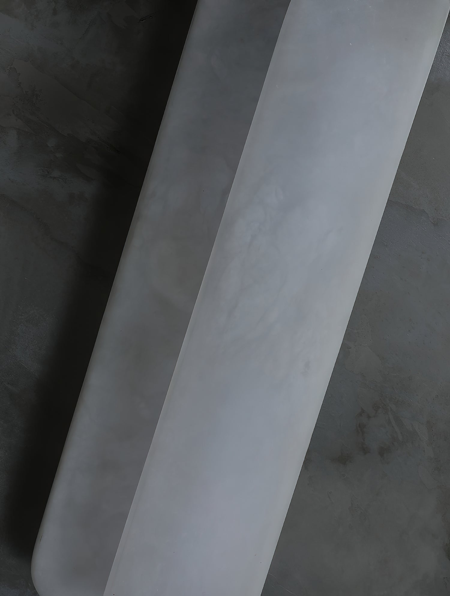 Close view of the Clérachic Alabaster Wall Sconce where one plate steps in front of the other, the seam running the full height of the stone.