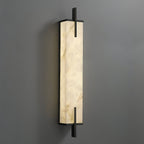Close angled view of this Clérachic alabaster wall light, showing deep veining in the stone and a slim black frame.