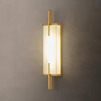 Close view of this Clérachic wall light with a gold-toned frame, its alabaster panel glowing warmly on a taupe wall.