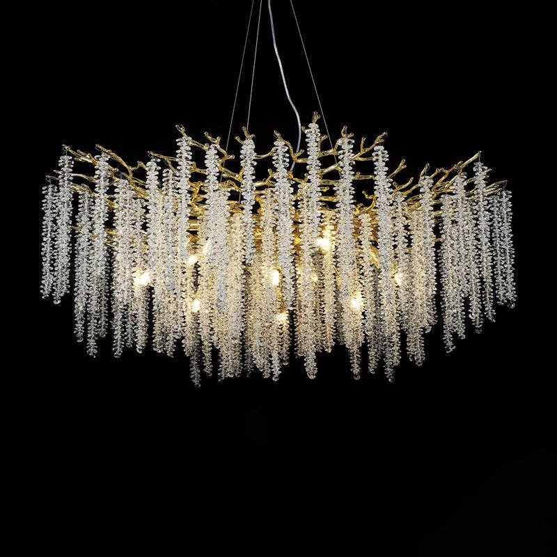 A wider Clérachic Albero chandelier on black, crystal falls spreading the full width of the frame.