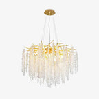The Clérachic Albero chandelier on white, gold branches above long clear crystal strands.