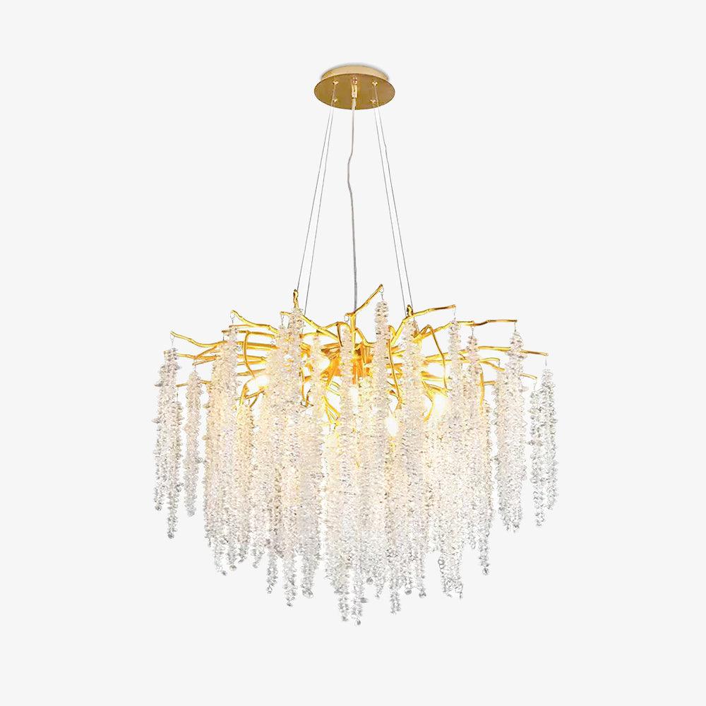 The Clérachic Albero chandelier on white, gold branches above long clear crystal strands.