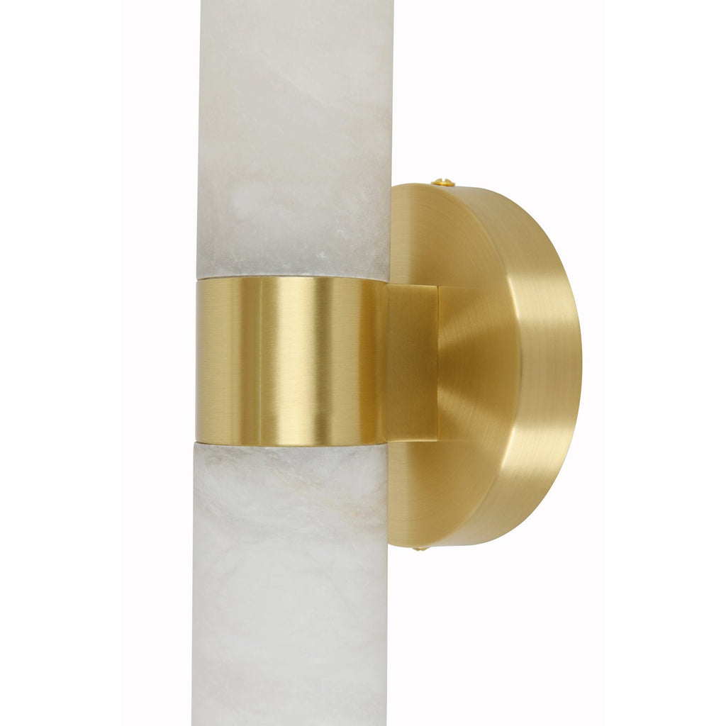 Clérachic Alight wall lamp in macro, the brushed brass band and its mounting stem meeting the alabaster tube.