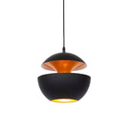 Smaller black pendant with a gold interior and a lit opening below, hung on a black cord, from Clérachic.