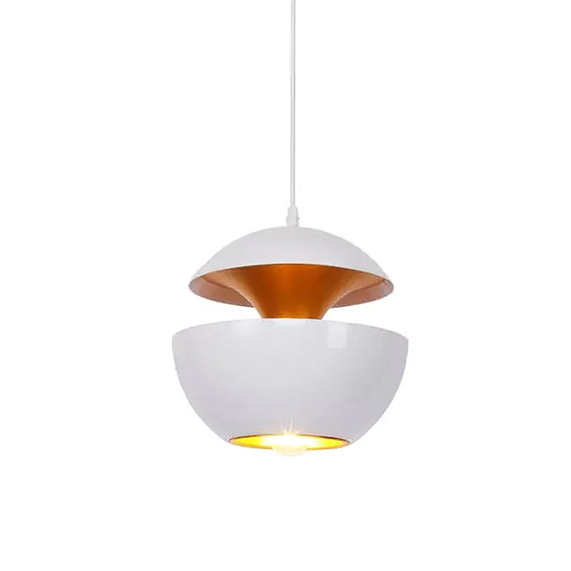 White bowl pendant with a gold interior and a bare bulb visible underneath, hung on a white cord, from Clérachic.
