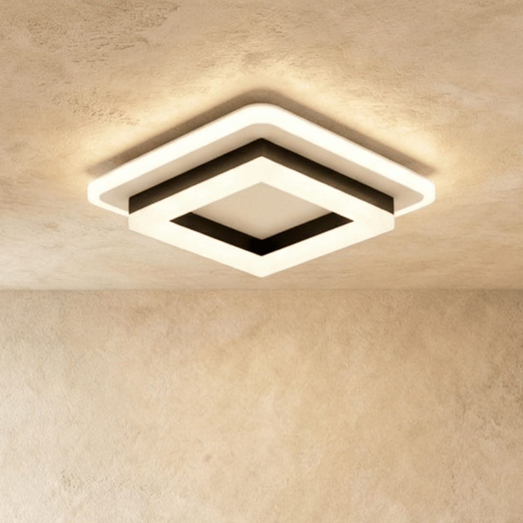 Clérachic stacked square ceiling light in black and frosted white acrylic, switched on and glowing warm against a limewash ceiling.