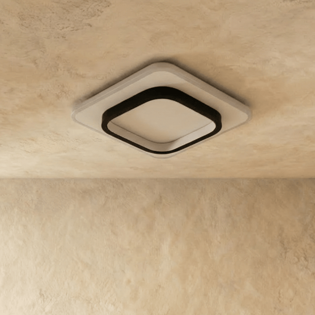 Clérachic rounded-square flush ceiling light in black and white acrylic, shown switched off against a limewash ceiling.