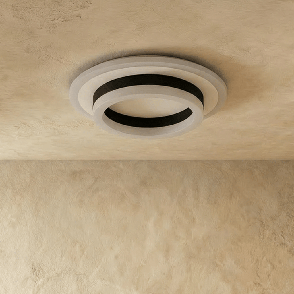 Clérachic two-tier round ceiling light in black and frosted white acrylic, shown unlit against a limewash ceiling.