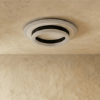 Clérachic two-tier round ceiling light in black and frosted white acrylic, shown unlit against a limewash ceiling.