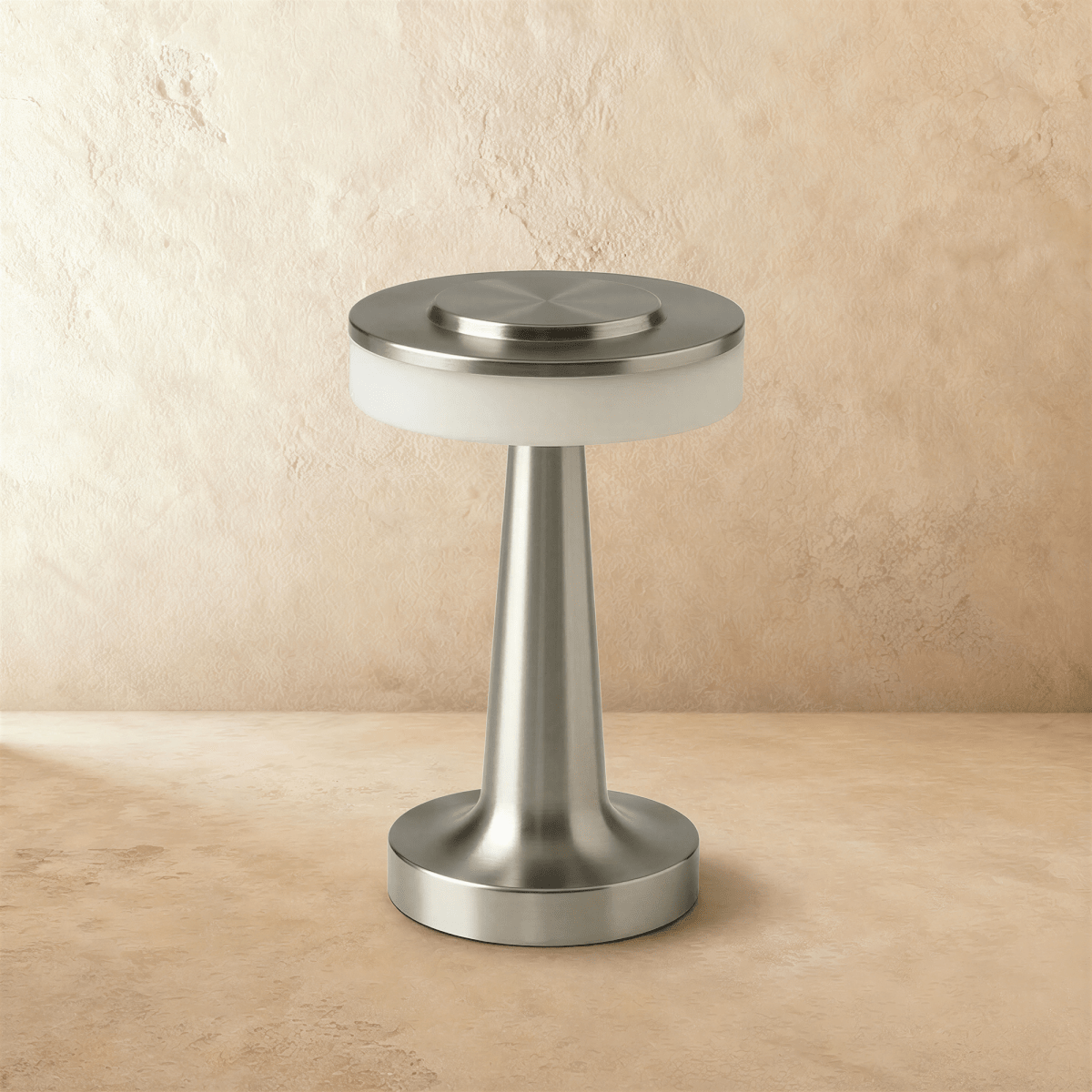 Clérachic cordless table lamp in brushed silver, unlit, showing the opal diffuser band under its flat metal disc top