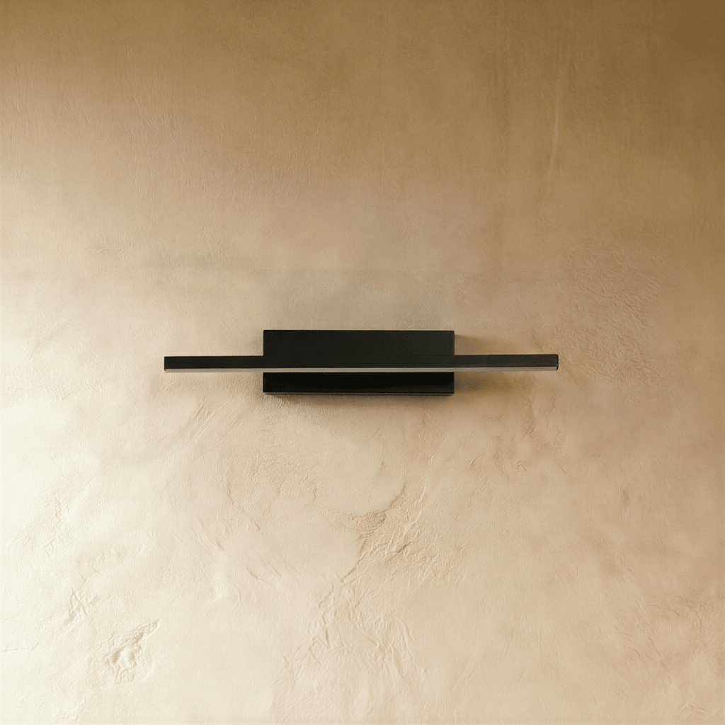 Clérachic black bar wall light switched off, showing its slim matte black aluminium arm and rectangular wall plate.