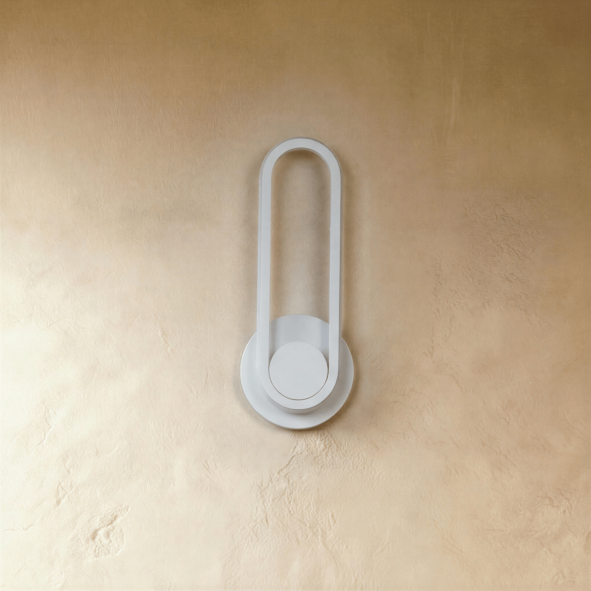 Clérachic white oval ring wall light switched off, a slim loop on a round backplate against a textured limewash wall.