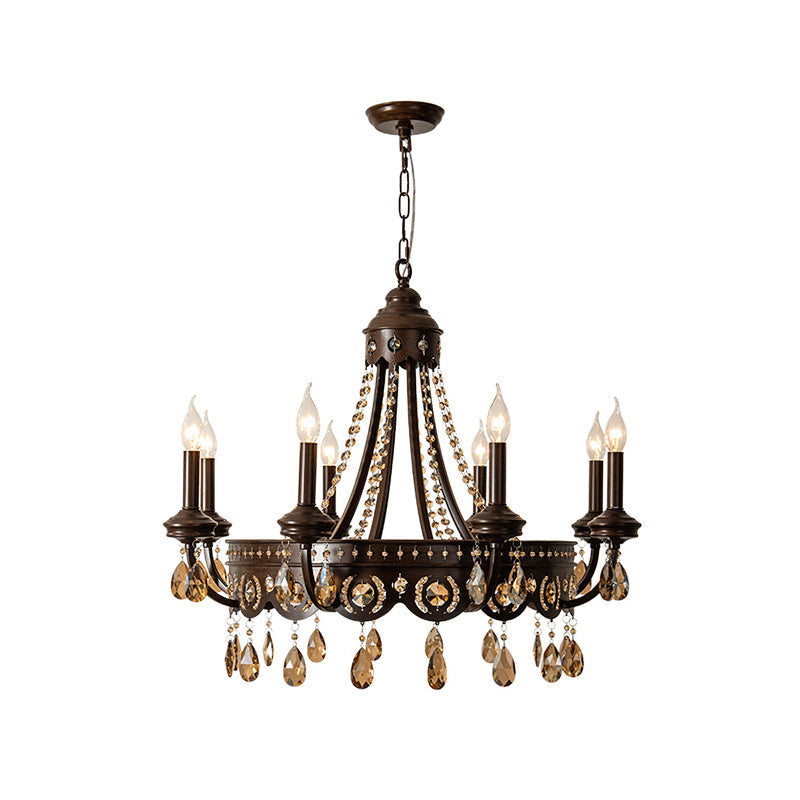Clérachic chandelier with eight candle lights, amber crystal drops and a bronze-finish frame, on a white background.
