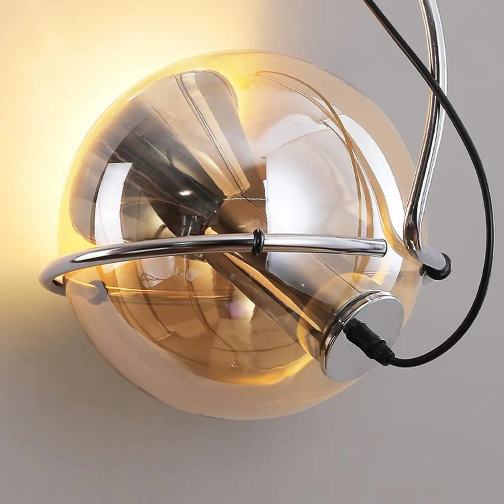 Looking up at the Clérachic Amber Glass Dome Pendant Light, chrome fittings catching light inside the amber globe.