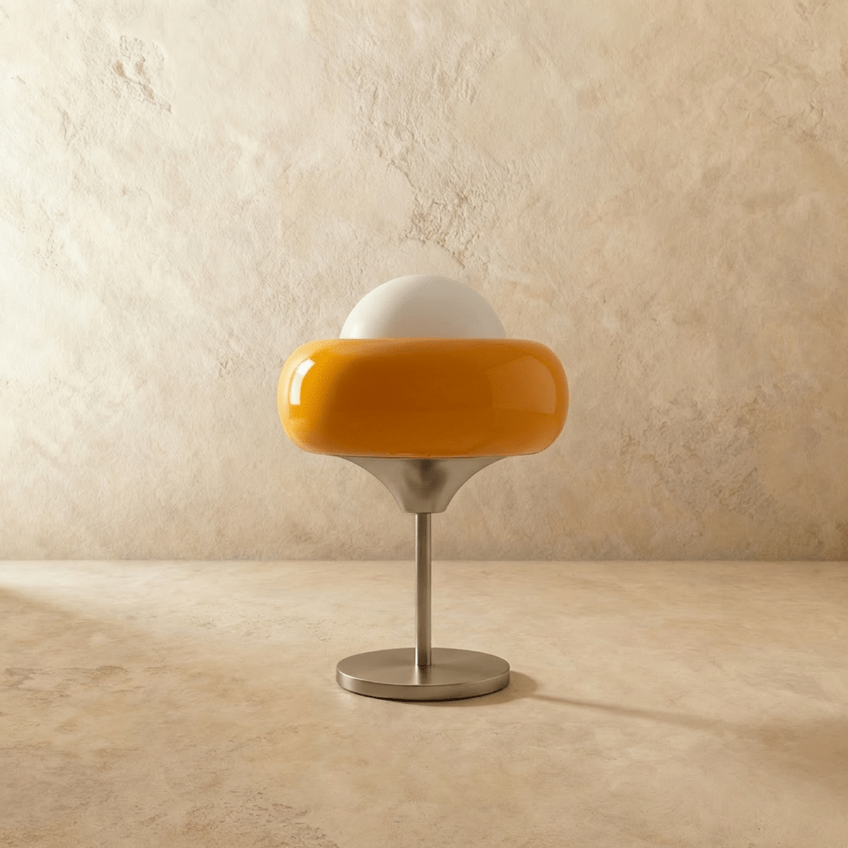 Clérachic table lamp switched off, showing the amber glass ring shade, white opal dome and brushed chrome base on limewash.