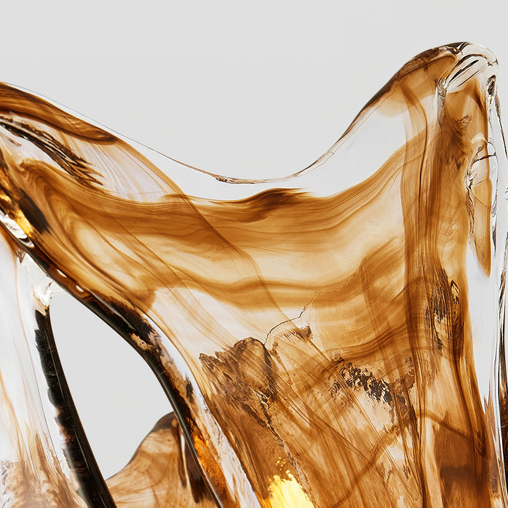 Close view of the streaked amber and clear glass at the flared rim of this Clérachic wall lamp shade.