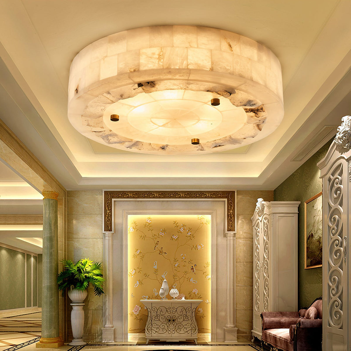Round Clérachic alabaster ceiling light glowing in a recessed cove ceiling, above a hallway with columns and a gold wall panel.
