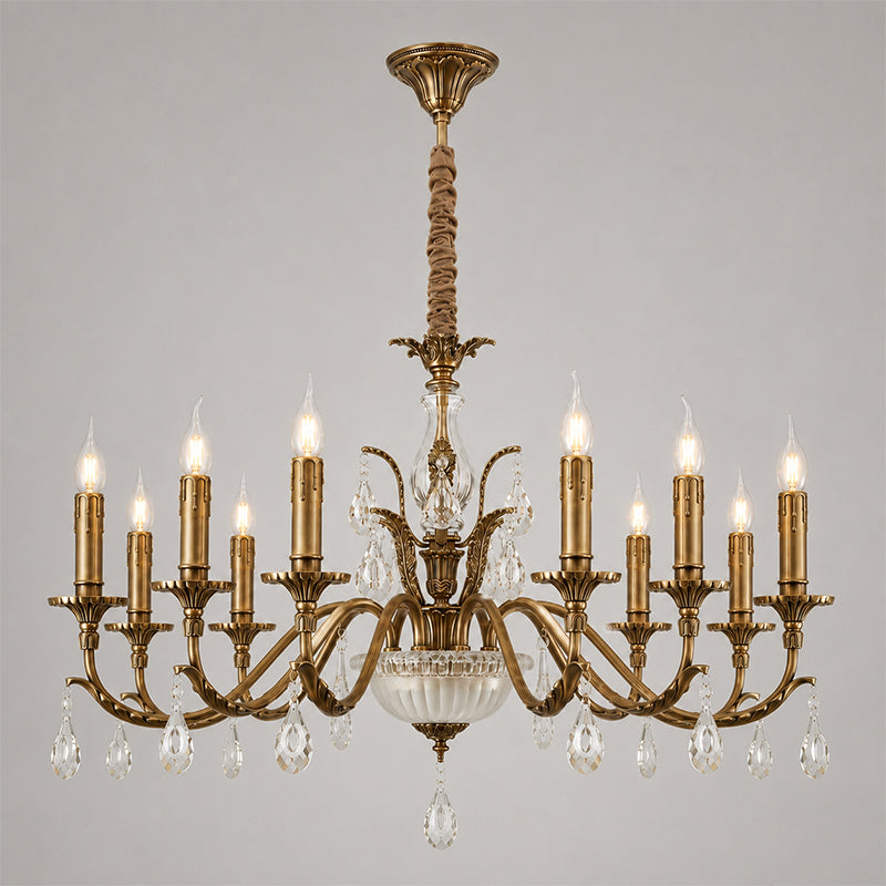 A larger Clérachic antique brass chandelier on grey, with ten candle-style lights and two tiers of crystal drops beneath its arms.