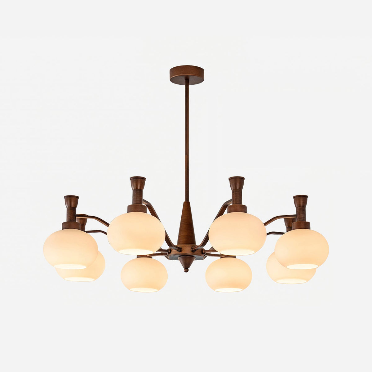 The trumpet-topped arm version of this Clérachic chandelier, unlit, with cream glass shades and a bronze stem on a white backdrop.