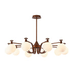 The widest swept-arm Clérachic chandelier, with round cream glass globes on antique bronze arms and a flat ceiling plate, on white.