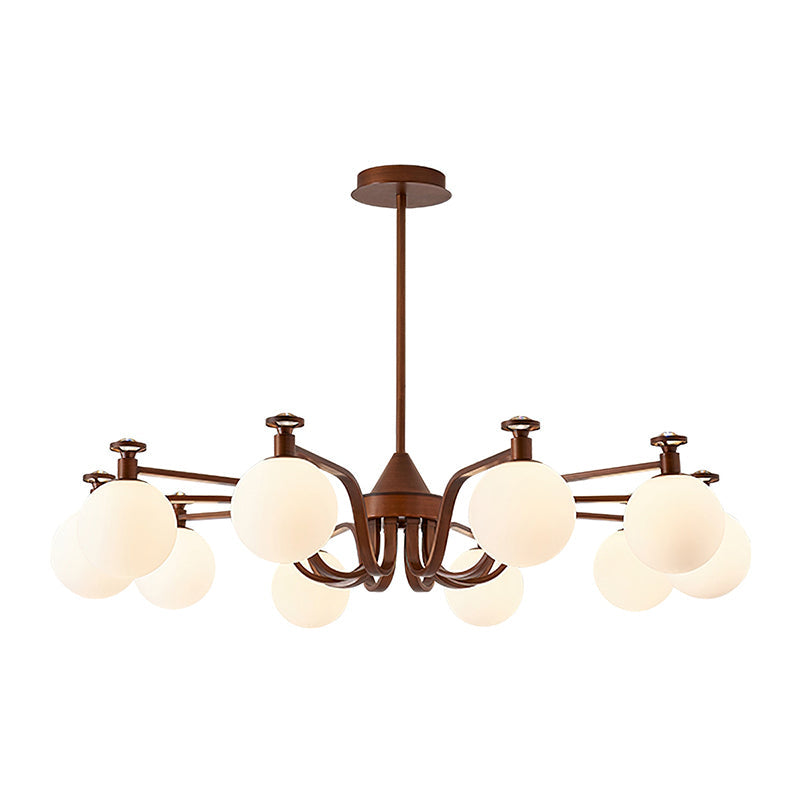 The widest swept-arm Clérachic chandelier, with round cream glass globes on antique bronze arms and a flat ceiling plate, on white.
