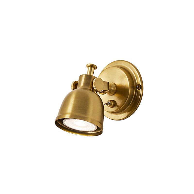 Antique gold Clérachic wall light with a round backplate and domed shade, photographed on a plain white background.