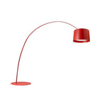 Red Clérachic arc floor lamp with a red drum shade and flat round base, shown on a plain white background.