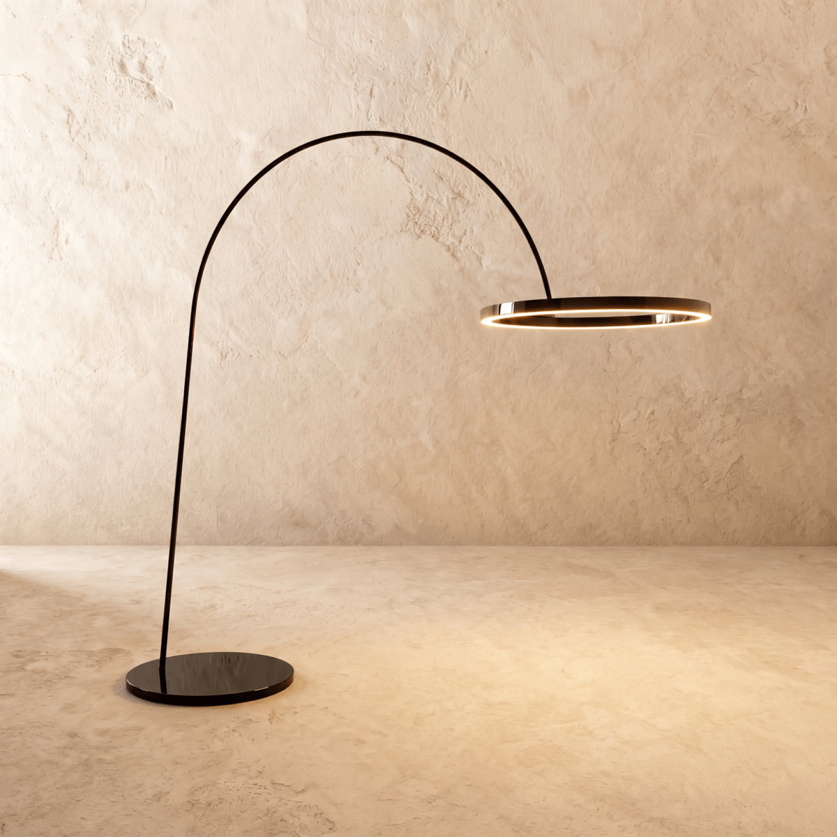 Clérachic taller arc floor lamp with a glossy black ring and round black base, the ring edge lit with a warm line.
