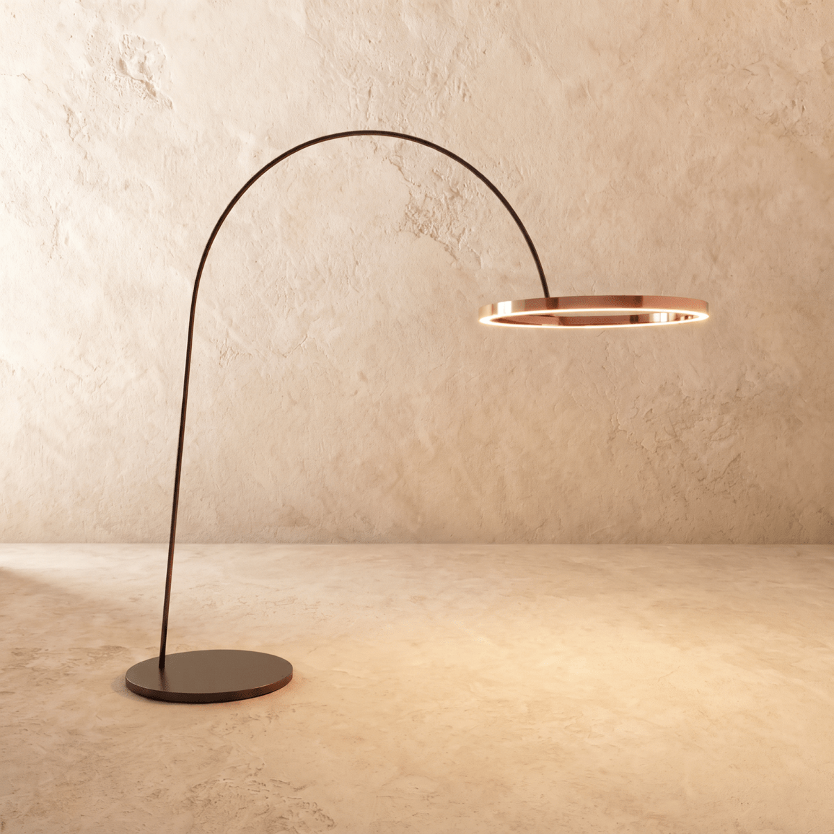 Clérachic taller arc floor lamp with a polished rose gold ring on a black arm, its edge lit with a warm line of light.