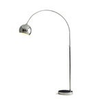 A Clérachic arc floor lamp with a chrome ball head and a dark disc base, shown on a plain white background.