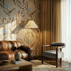 Clérachic arched floor lamp glowing behind a tan leather sofa, beside a plaid armchair and a floral wall covering.