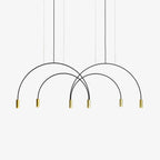 Black crossing arches ending in six brass spot heads, this Clérachic pendant light on a plain white backdrop.