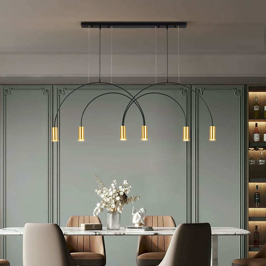 Above a marble dining table, this Clérachic pendant light hangs from a black canopy bar with six brass spot heads, against a sage-green panelled wall.