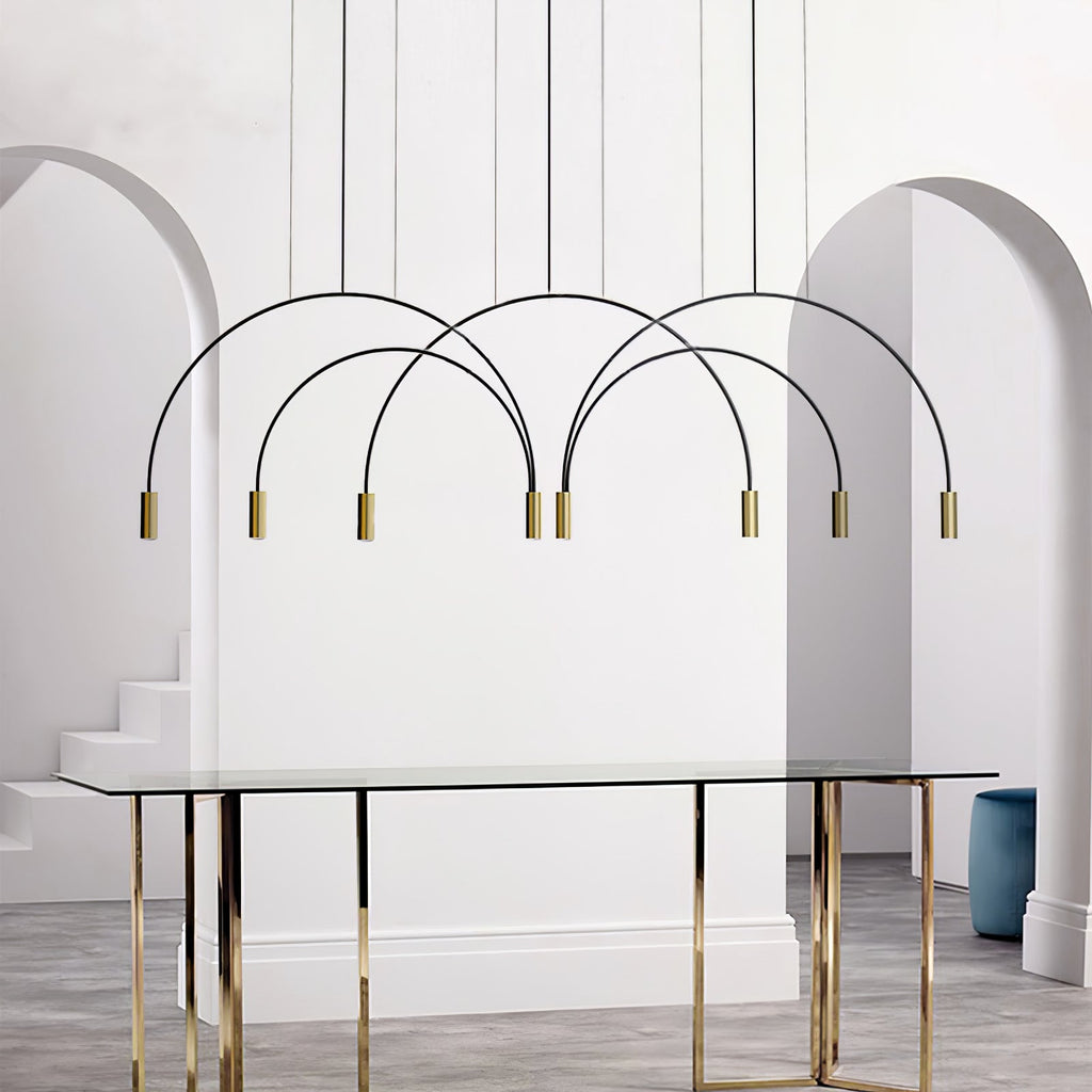 Black arches and brass spot heads on this Clérachic pendant, framed by two white archways above a glass dining table.
