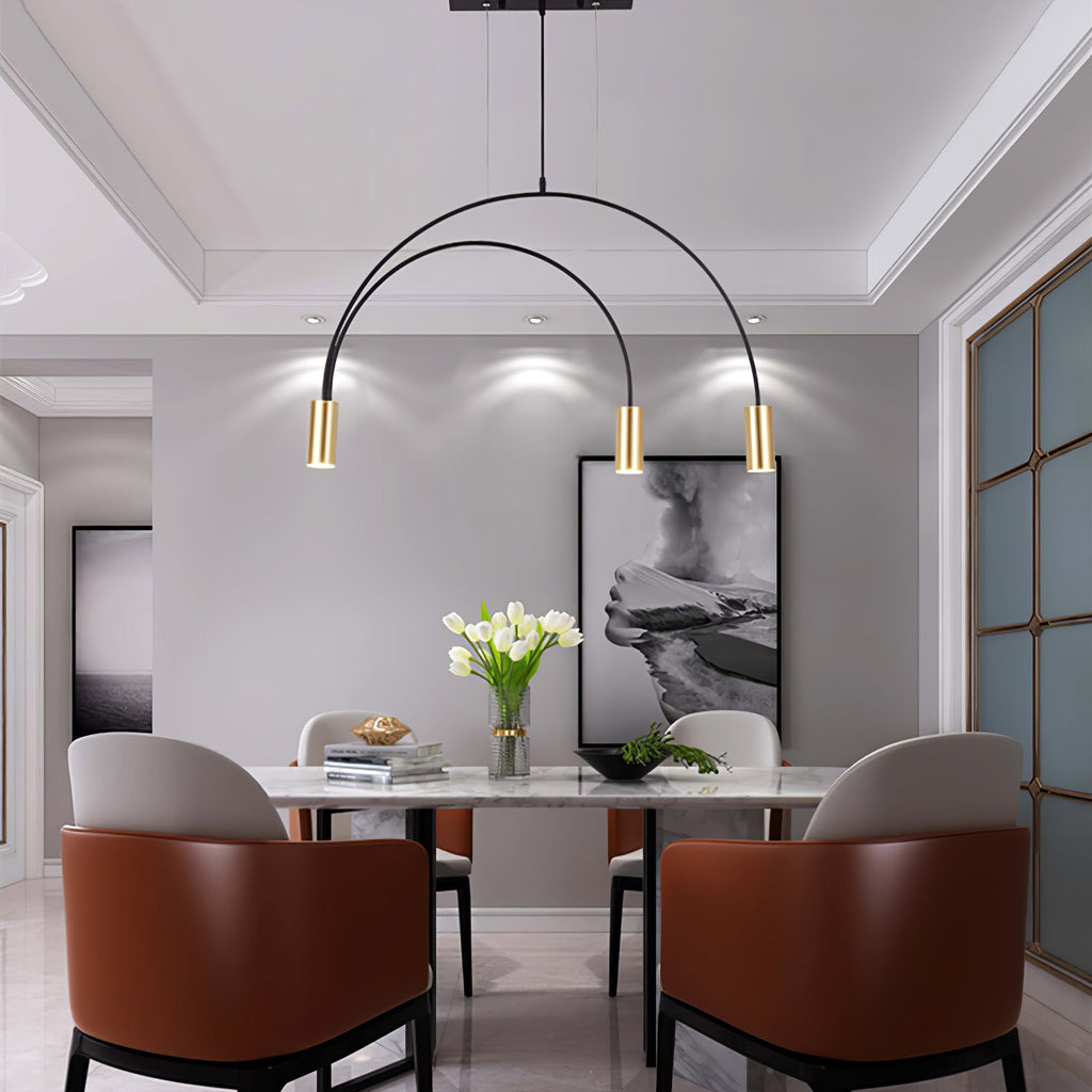 Over a marble dining table, this Clérachic pendant has two nested arches, three lit brass spot heads and a slim canopy.