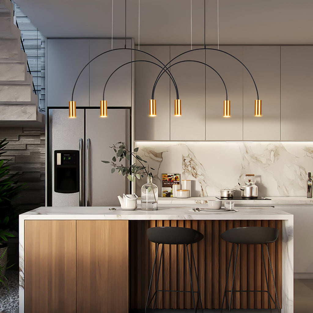 Six lit brass spot heads hang from black arches on this Clérachic pendant, above a marble and timber kitchen island.