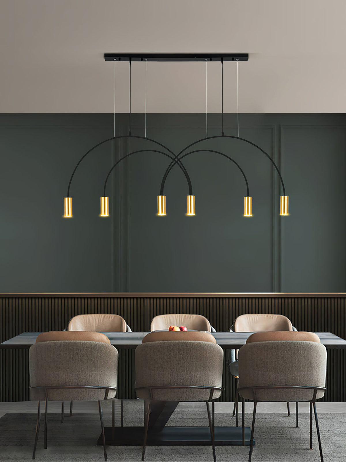 Six brass spot heads glow under black arches on this Clérachic pendant, against a deep green wall and grey chairs.