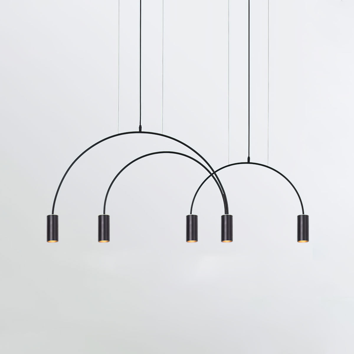 Five black spot heads and three black arches, this Clérachic pendant seen on a pale grey backdrop.