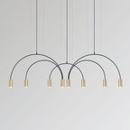 Eight brass spot heads on interlocking black arches, this Clérachic pendant on a pale grey backdrop.