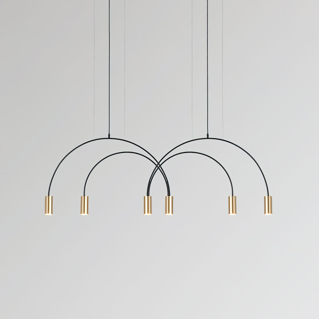 Six brass spot heads hang in an even row beneath the crossing black arches of this Clérachic pendant.