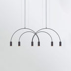Six black spot heads at staggered heights under overlapping arches on this Clérachic pendant.