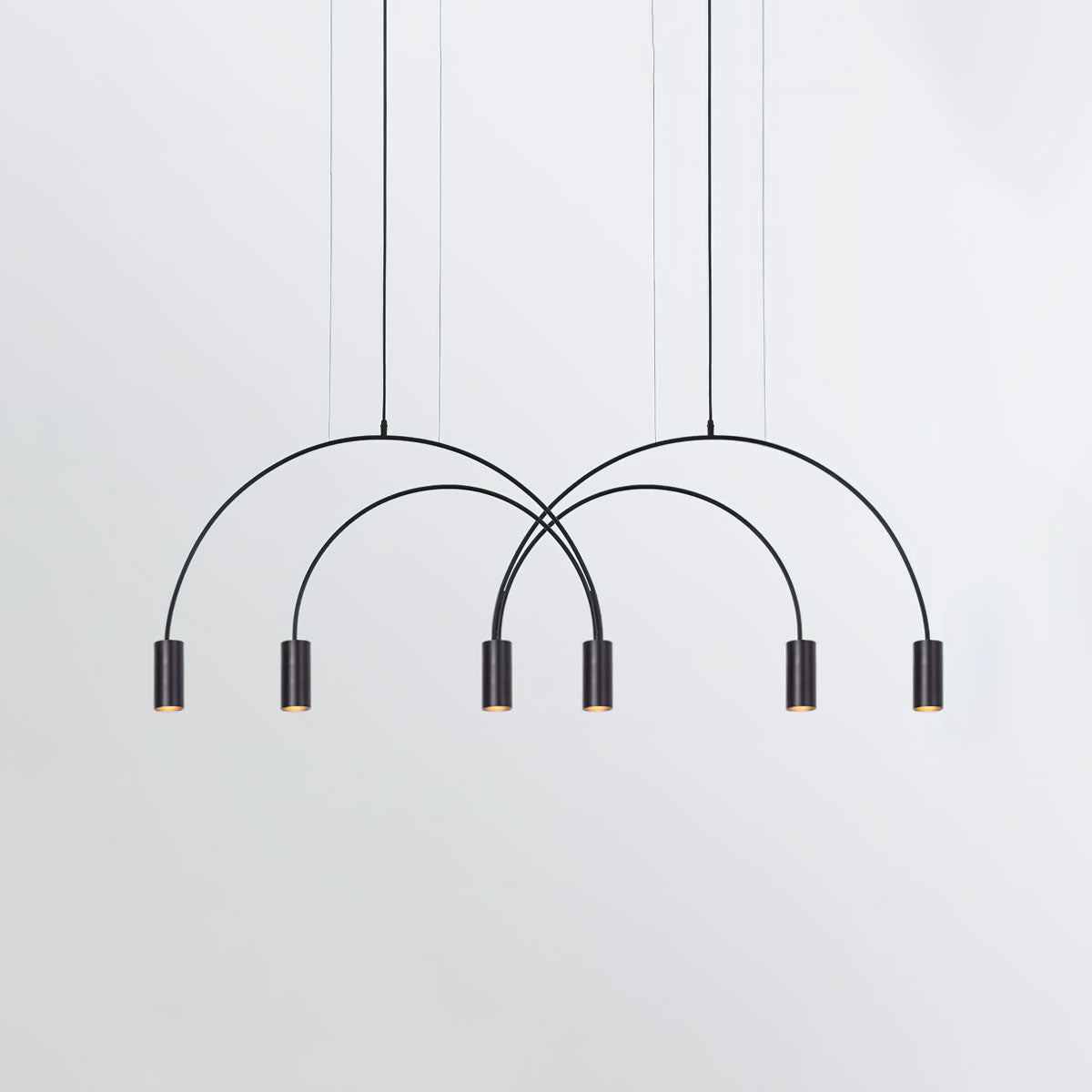 Six black spot heads at staggered heights under overlapping arches on this Clérachic pendant.