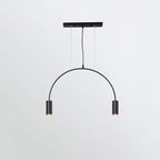A single black arch with two spot heads hangs from a flat black canopy bar on this Clérachic pendant.